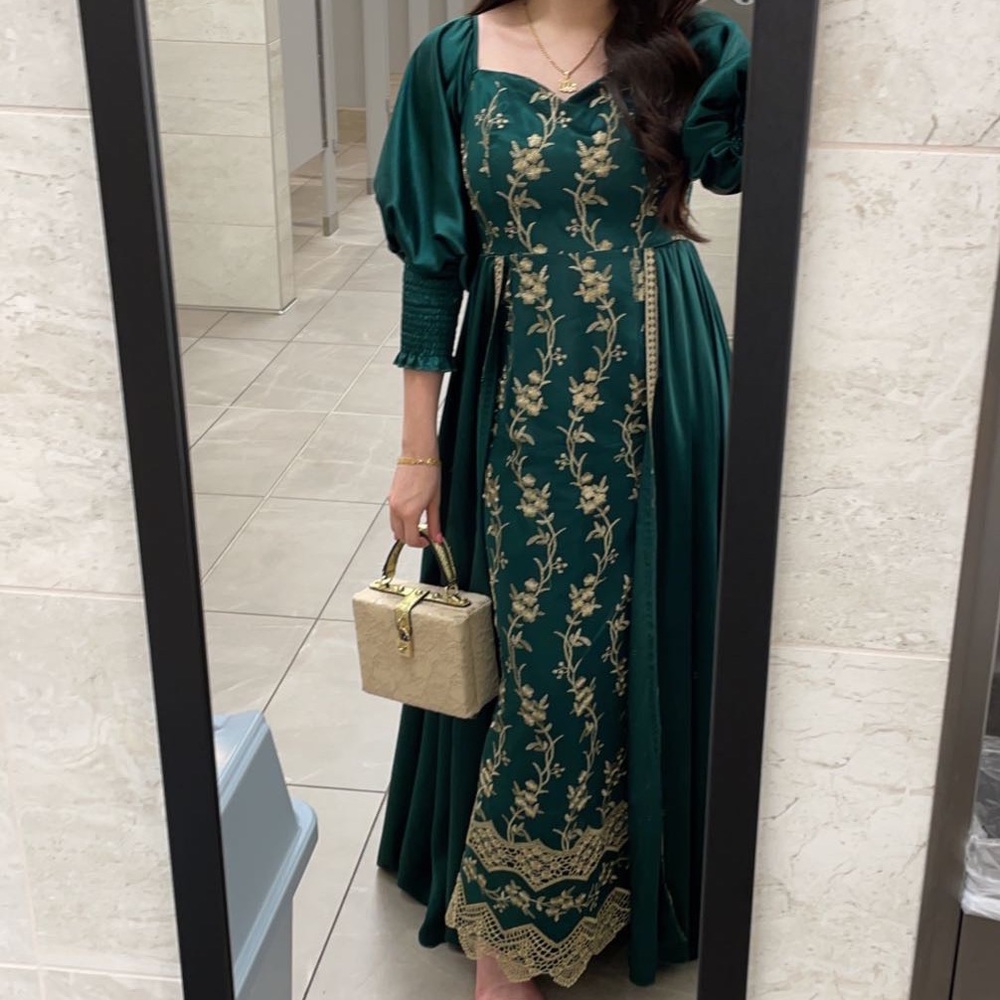 Worn once emerald green with gold detailing dress.